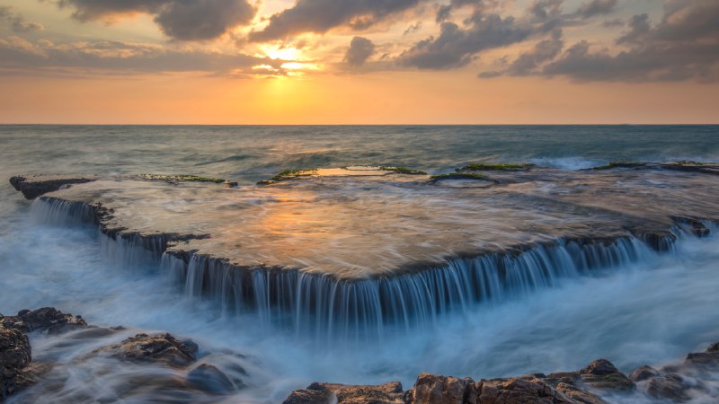A tidal tangoSeawater cascades over an ancient coral reef, Hang Rai, Vietnam (© Thang Tat Nguyen/Getty Images)