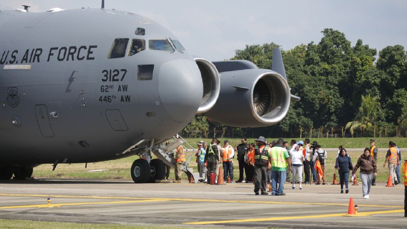Scoop: First flight leaves U.S. under Trump's $1,000 