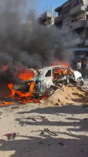 A video documenting a car on fire after an aerial bombardment by the occupation in the "Sheikh Radwan" neighborhood in Gaza City.